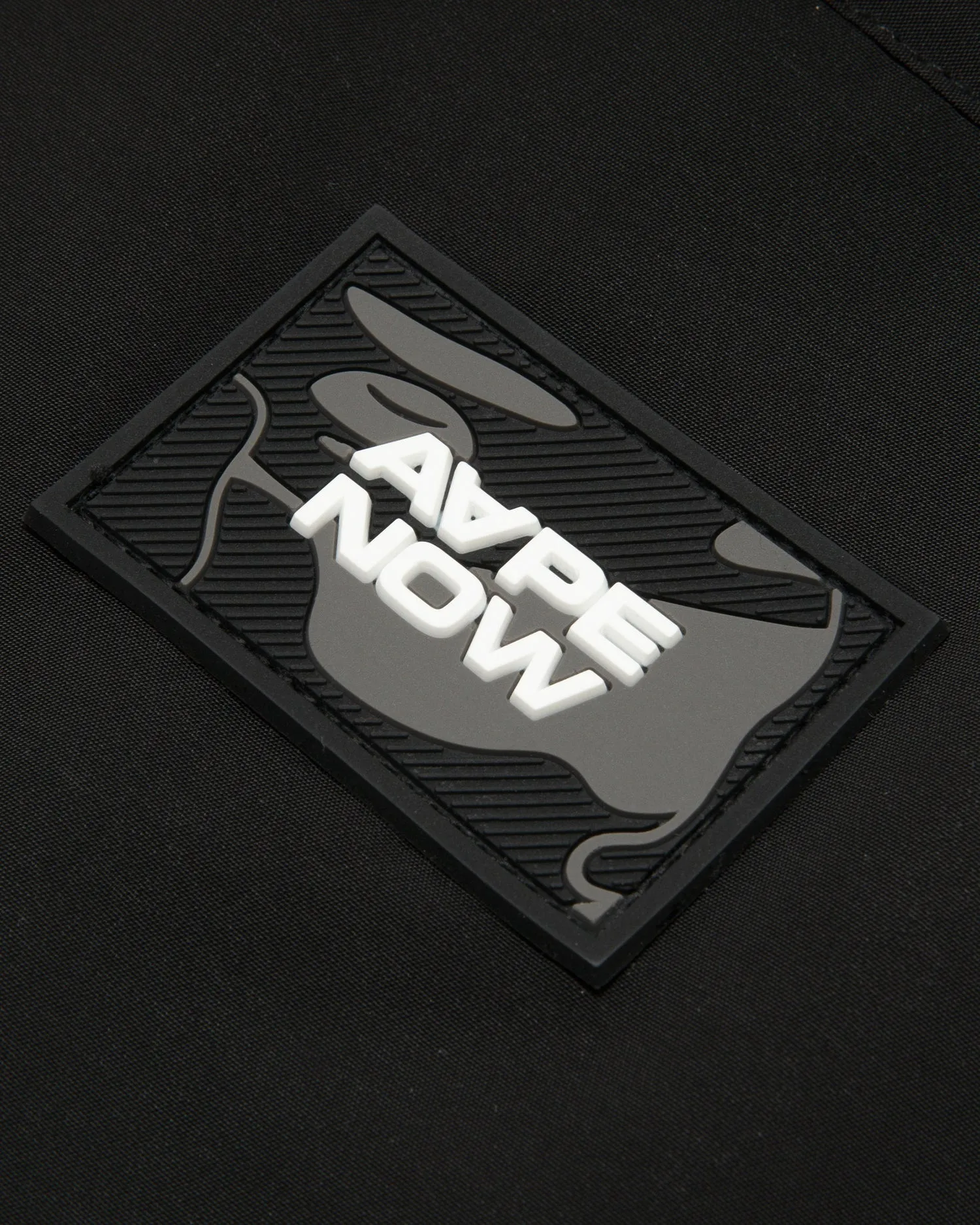 AAPENOW moonface logo coach jacket