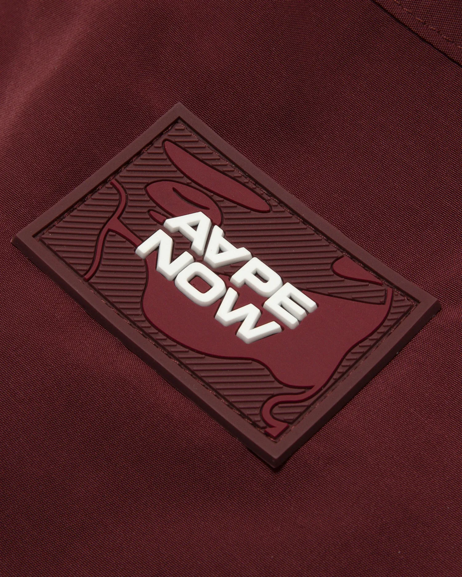 AAPENOW moonface logo coach jacket