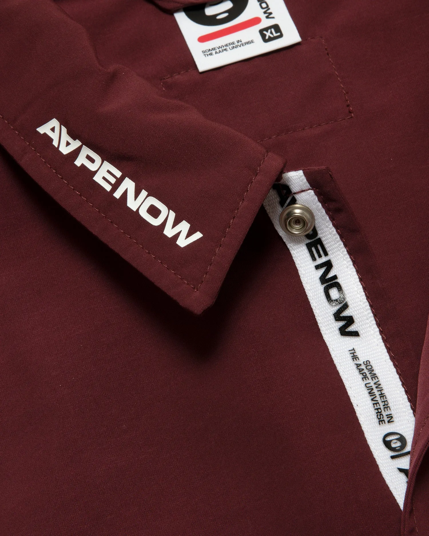 AAPENOW moonface logo coach jacket