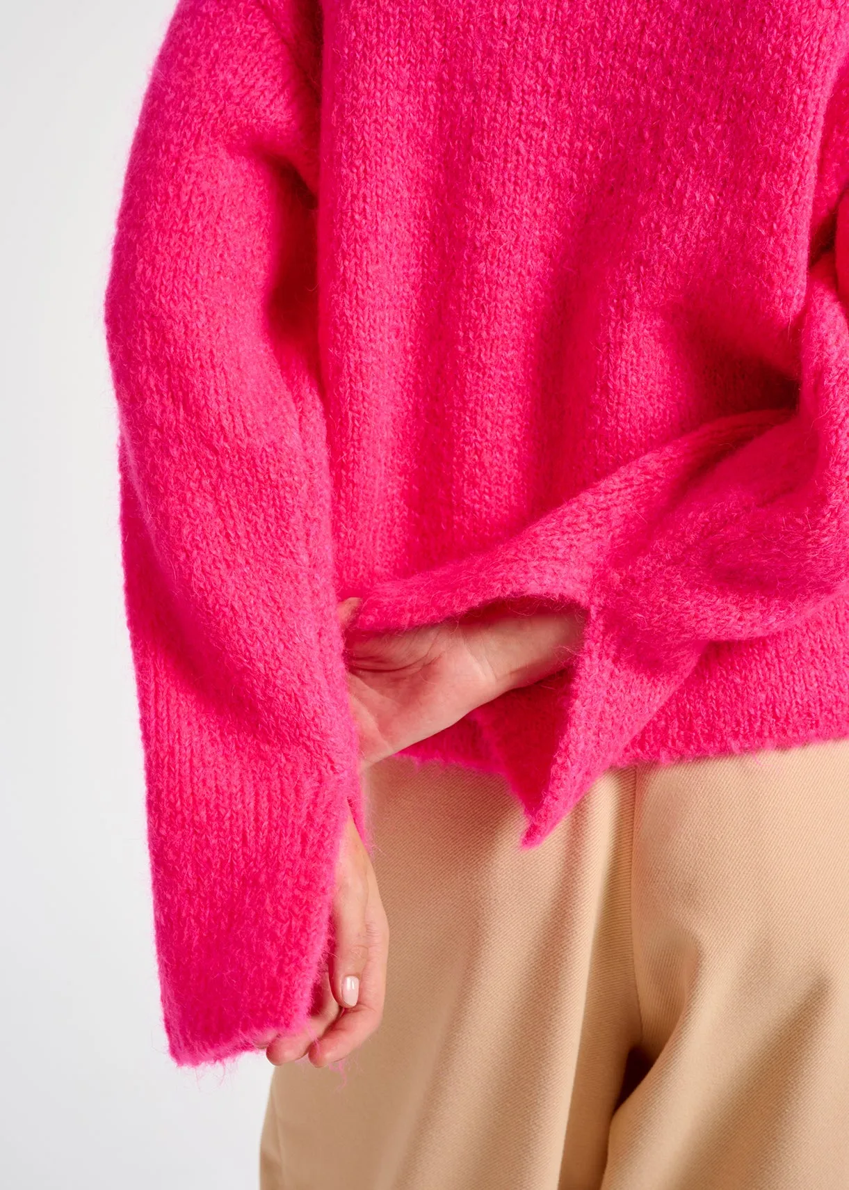 Neon pink mohair-blend turtleneck sweater