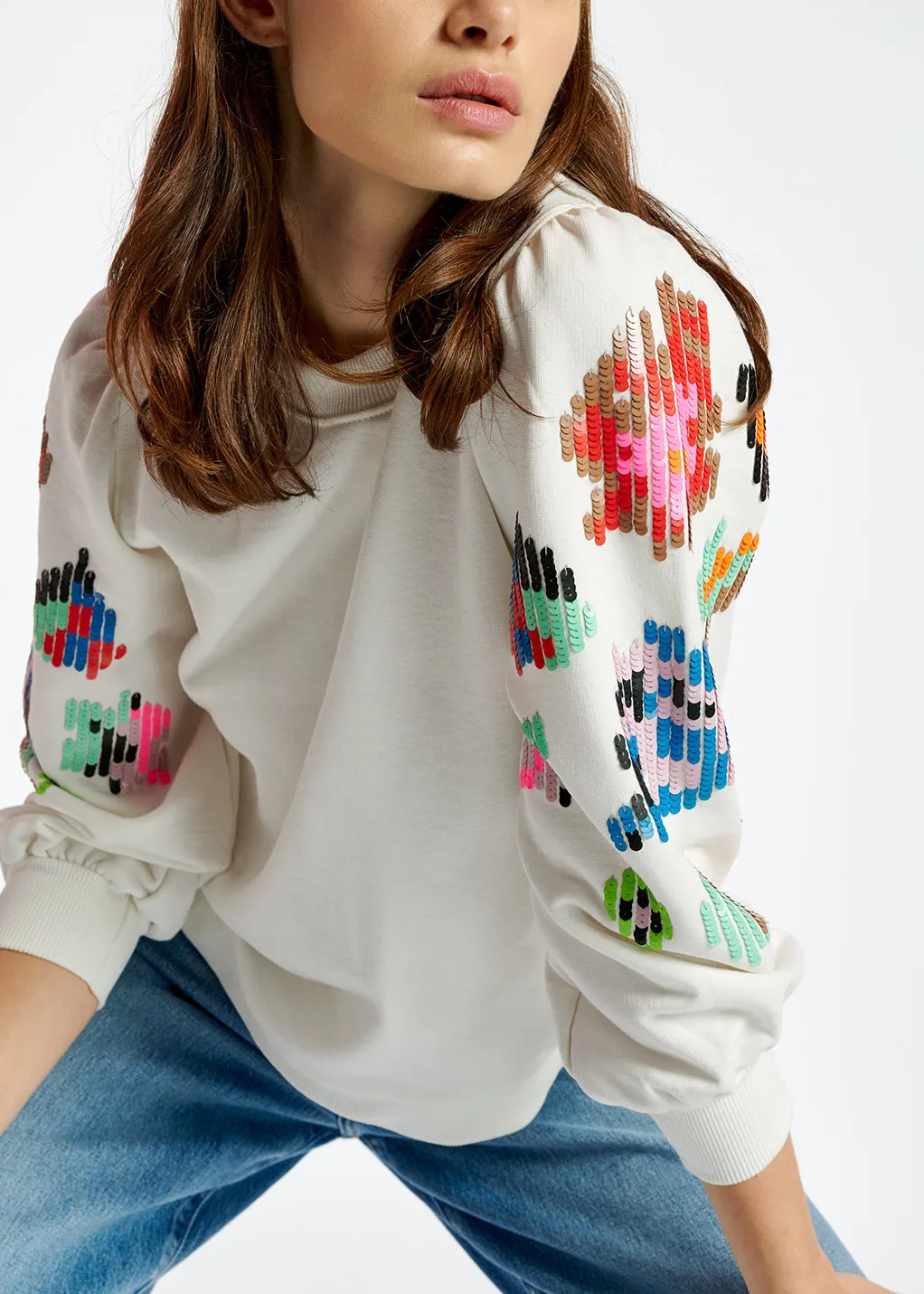 Off-white sweater with multicolor sequin embroideries