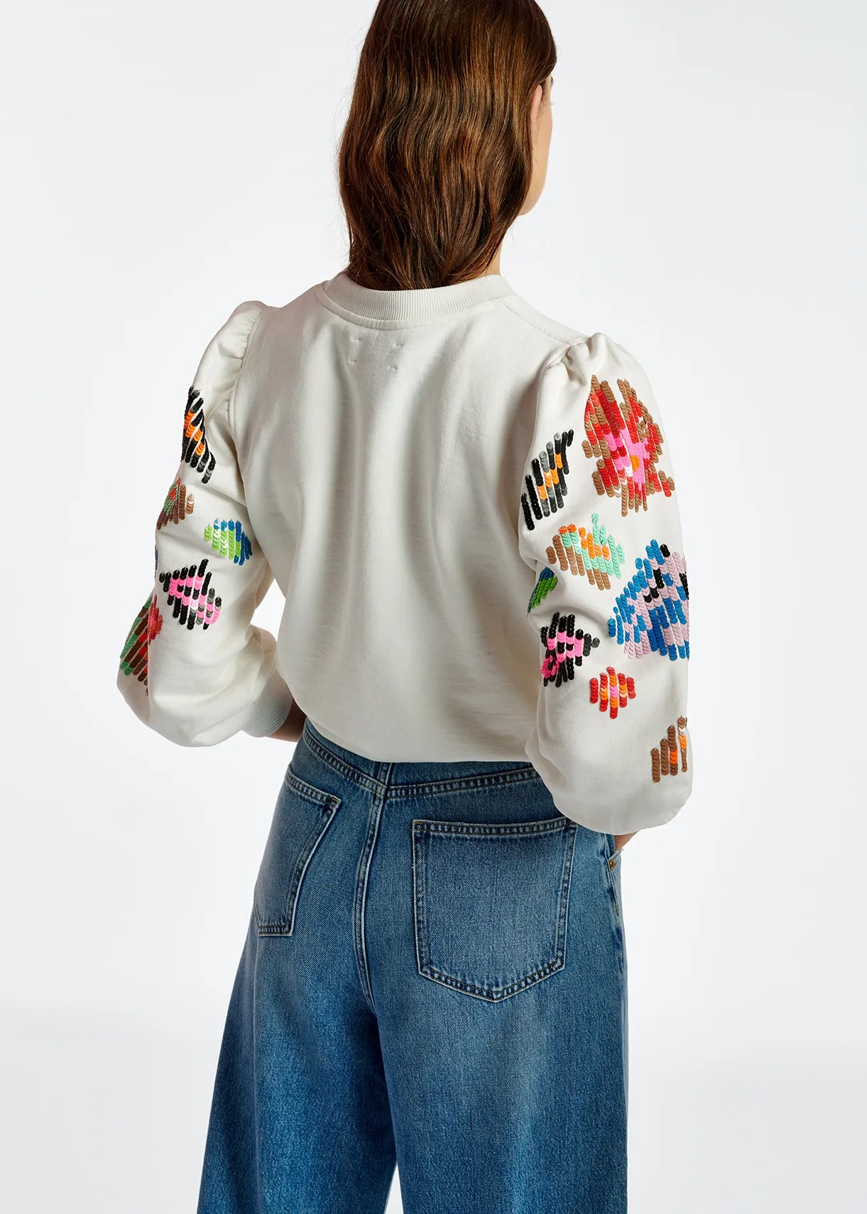 Off-white sweater with multicolor sequin embroideries